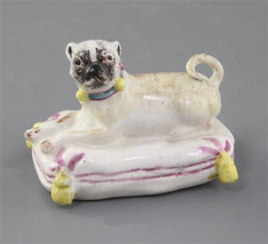 An extremely rare Derby or Girl-on-a-Horse factory figure of a pug, c.1755, l. 6.5cm, some restoration